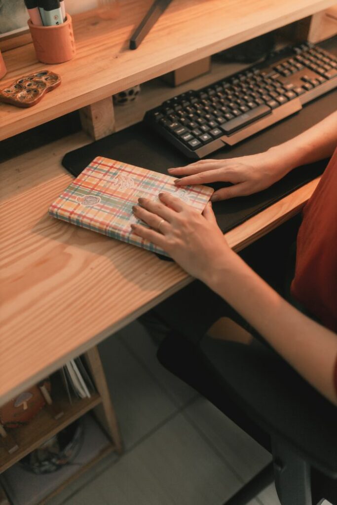 Crafting Captivating Headlines: Your awesome post title goes here Warm-toned home office desk with keyboard and notebook, highlighting a cozy workspace ambiance.